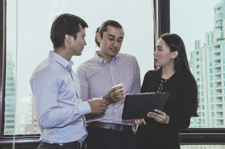 Business Concepts. Young business man working in office. Young business people are working...