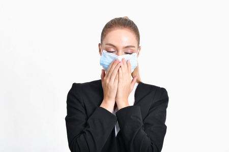 Business concept. Young businesswoman is very sick. Young businesswoman is on a white background.