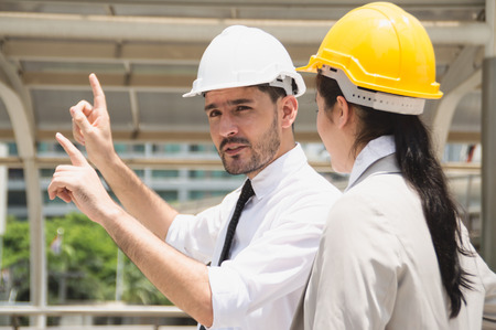 Business concept. Businessmen are working on engineering. Businessmen are planning work outside the...
