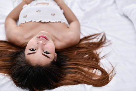 Sexy women concept. Sexy girl are playing in the bedroom.の写真素材