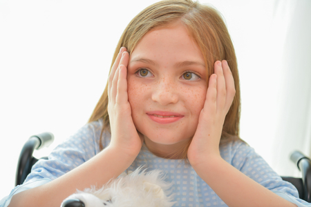 Medical concept. Young patients have good morale in treatment. The patient is smiling happily in the hospital.の写真素材