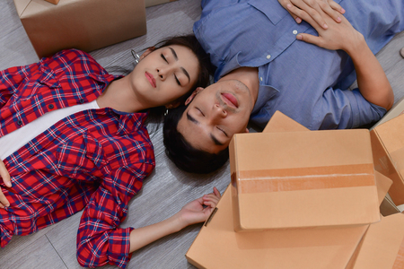 Sme business concept. Young are sleeping in the office. Business people work hard and tired.の写真素材