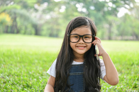 Communication concept. Girls are using the phone to study. Girls use phones to communicate.の写真素材