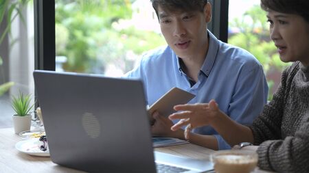 Holiday concept. Business people work earnestly in a coffee shop. 4k Resolution.