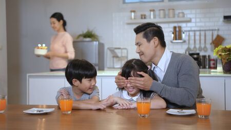 Family concept. Parents are celebrating birthdays for their children. 4k Resolution.の写真素材