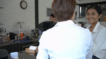 Coffee shop concept. happy man or waiter with cup serving customer at coffee shop. 4k Resolution.