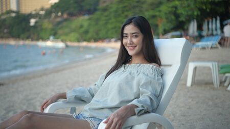 Holiday concept. Beautiful girls are smiling happily on the beach. 4k Resolution.