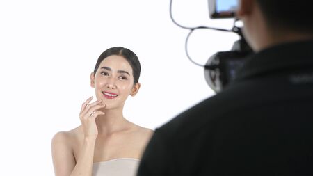 Beauty concept. A beautiful woman modeling in a white studio. 4k Resolution.