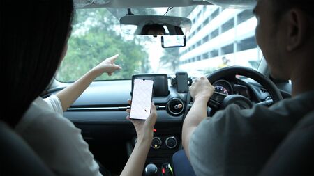 Travel Concept. Young men and women are traveling with maps pointing their way from satellites.