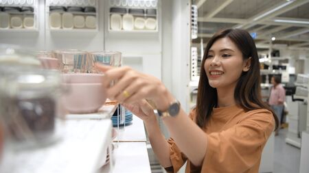 Shopping concepts. An Asian woman is buying a container in the mall. 4k Resolution.