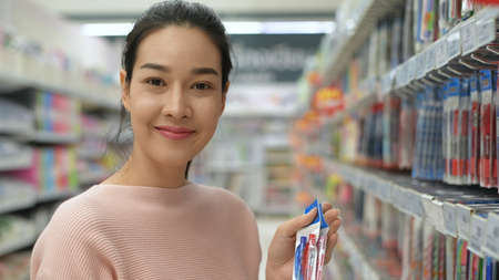 Shopping concepts. Asian women are buying stationery in the mall. 4k Resolution.の写真素材