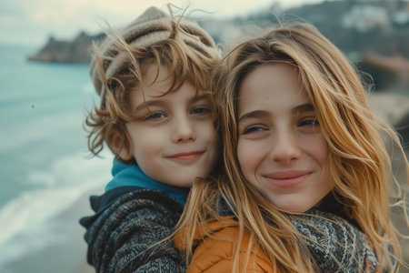 Caucasian mother and son hugging each other by the sea.の素材