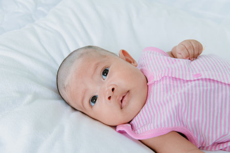 Asian baby girl looking innocently.