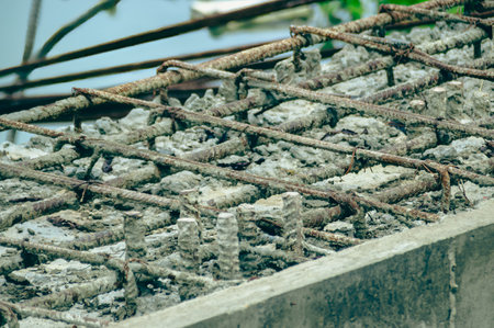 Close-up of a concrete slab with steel rebar grid for construction, highlighting the materials and techniques used.の写真素材