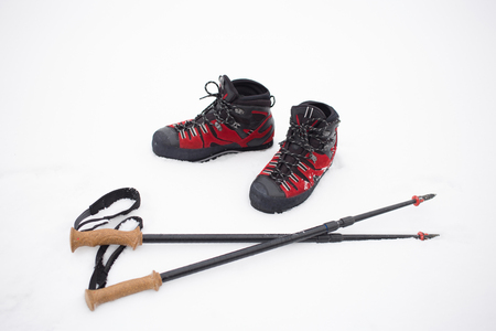 Climbing shoes red for difficult winter hikes.の写真素材