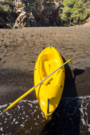 Kayak on the beach on a sunny day.の写真素材