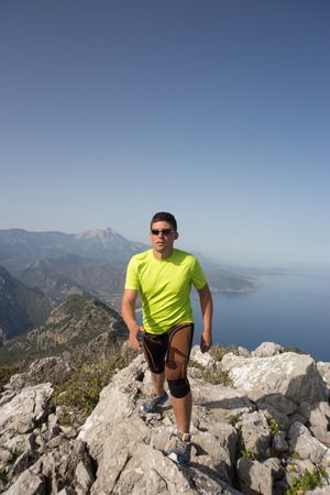 Running man in the summer in a beautiful location.の写真素材