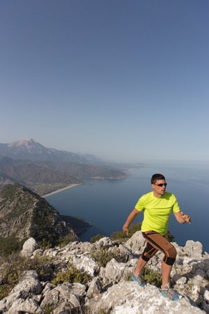 Running man in the summer in a beautiful location.の写真素材