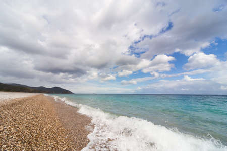 Beautiful sea paradise beach on a background of blue sky with clouds.の写真素材