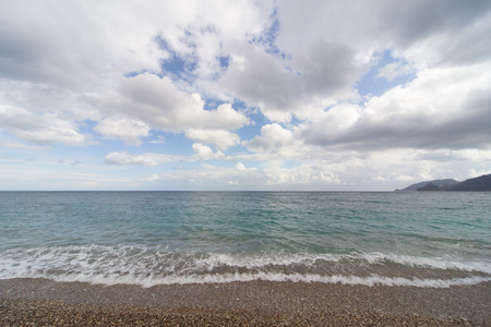 Beautiful sea paradise beach on a background of blue sky with clouds.の写真素材