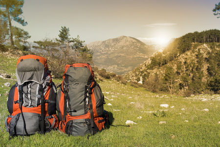 Camping with backpack in the mountains on a sunny summer day.の写真素材