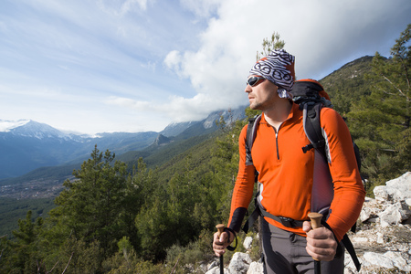 A man with a backpack hiking the mountains.の写真素材