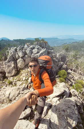 Help, support and help in a dangerous situation to hike in the mountains.の写真素材