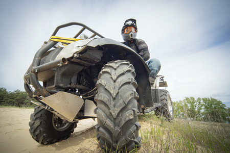Racing ATV on the sand in summertime.の写真素材