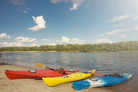 Camping with kayaks on the beach on a sunny day.の写真素材