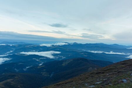 A beautiful sunrise overlooking the mountains in the summer.の写真素材