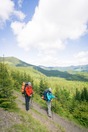 Summer hiking in the mountains on a sunny day.の写真素材