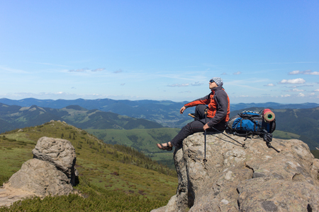 The guy with the backpack for mountain hiking in summer.の写真素材