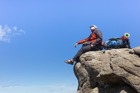 The guy with the backpack for mountain hiking in summer.の写真素材