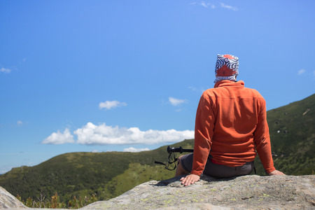 Man hiking in the mountains on a sunny day.の写真素材