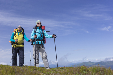 Hiking in the mountains in the summer on a sunny day.の写真素材