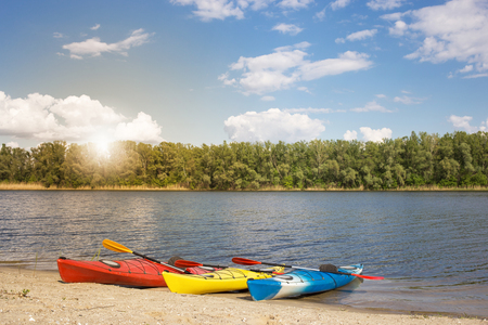 Camping with kayaks on the beach on a sunny day.の写真素材