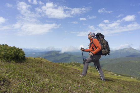 Hiking in the mountains in the summer on a sunny day.の写真素材