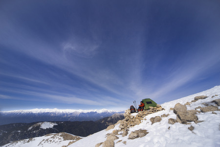 Camping on the top of the mountain in winter.の写真素材
