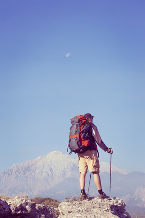 Summer hiking in the mountains with a backpack .の写真素材