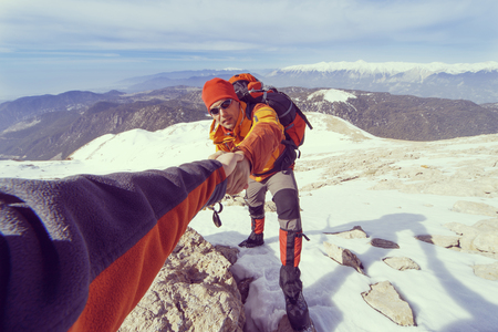 Help to overcome the mountainous terrain in the winter campaign.の写真素材