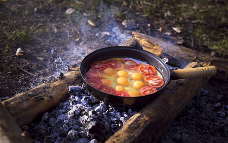 Cooking breakfast for the stake in the camping in the summer.の写真素材