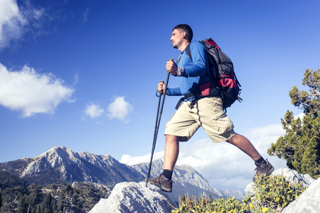 Summer hiking in the mountains with a backpack .の写真素材