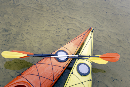 Camping with kayaks on the beach on a sunny day.の写真素材