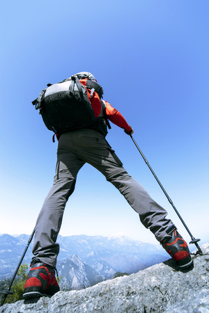 Summer hiking in the mountains with a backpack.の写真素材