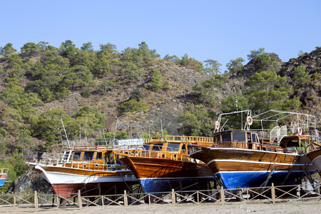 Ships are serviced on a sunny day.の写真素材