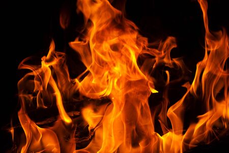 Beautiful fire flames on a black background.の写真素材