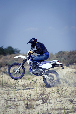 Racing Enduro motorcycle on a dirt track on a sunny day.の写真素材