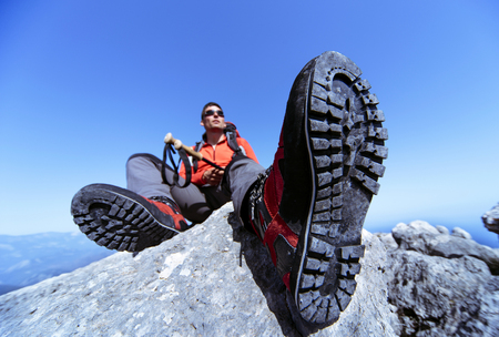 Summer hiking in the mountains with a backpack.の写真素材