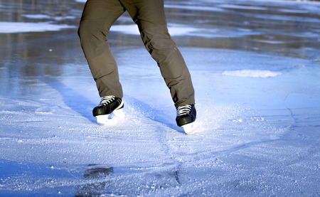 Winter sports ice skating on a sunny day.の写真素材