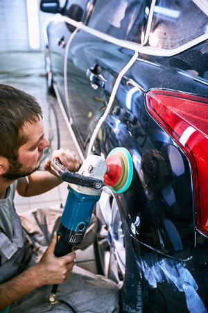 Preparing the car for sale at a service station.の写真素材